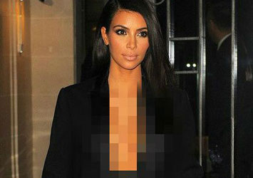 Kim Kardashian appears topless under open tuxedo jacket  