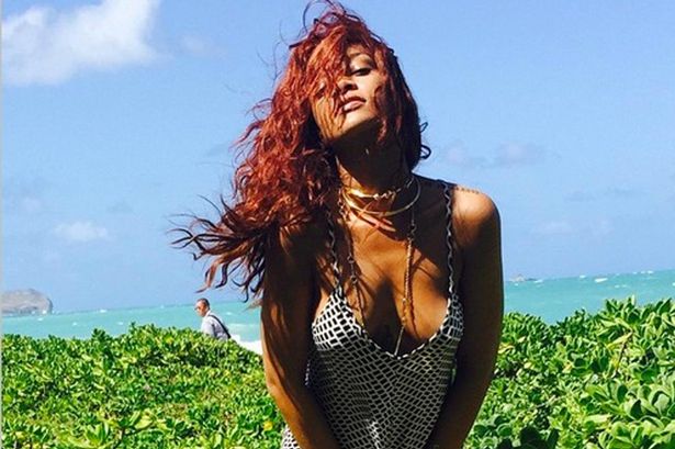 Rihanna poses for pictures on Hawaiian break 