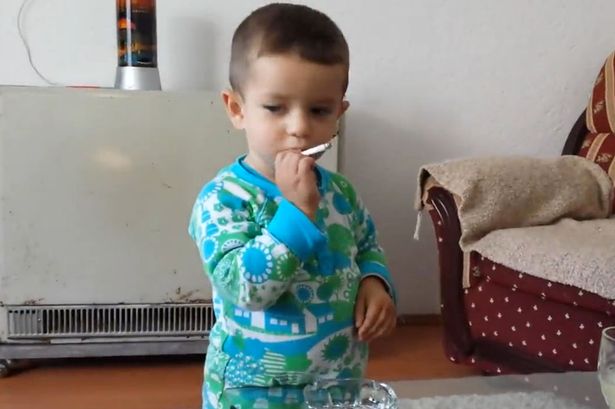 Toddler Encouraged to Smoke Cigarette