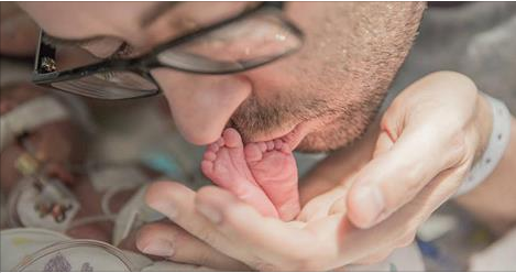 Widower sings heartbreaking rendition of Blackbird to dying newborn son