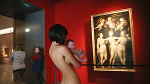  Woman walks around a German museum completely naked while holding a baby  
