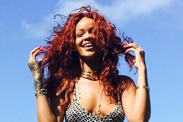 Rihanna poses for pictures on Hawaiian break 