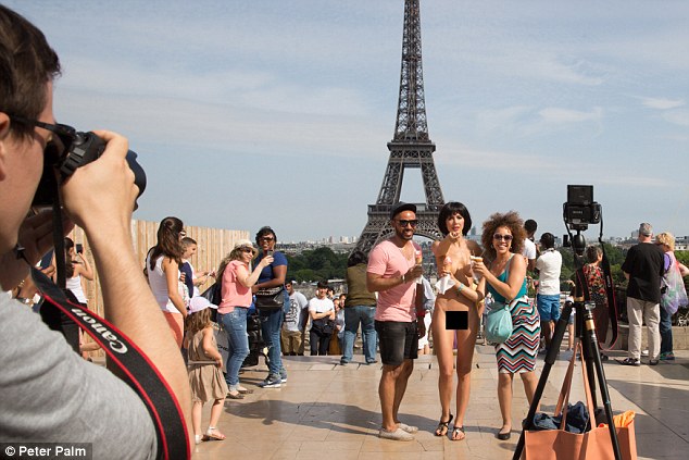 Model arrested after posing for NAKED selfies with tourists beside the Eiffel Tower