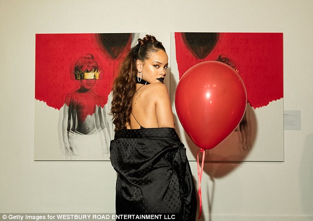 Rihanna oozes sex appeal as she unveils her long-awaited album cover