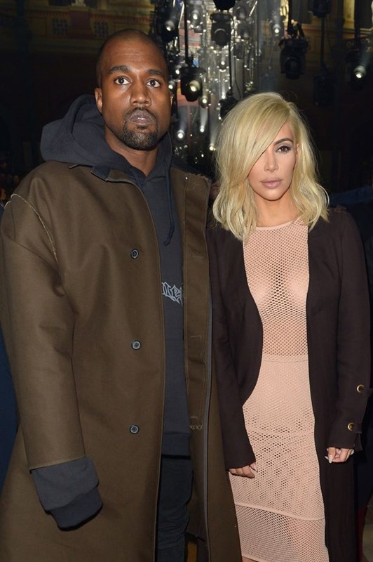 Blonde Kim Kardashian goes bra-less in nude mesh dress