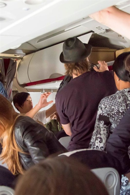 Angelina Jolie Brad Pitt and their six kids fly ECONOMY on a trip from Paris