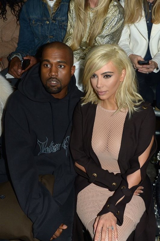 Blonde Kim Kardashian goes bra-less in nude mesh dress