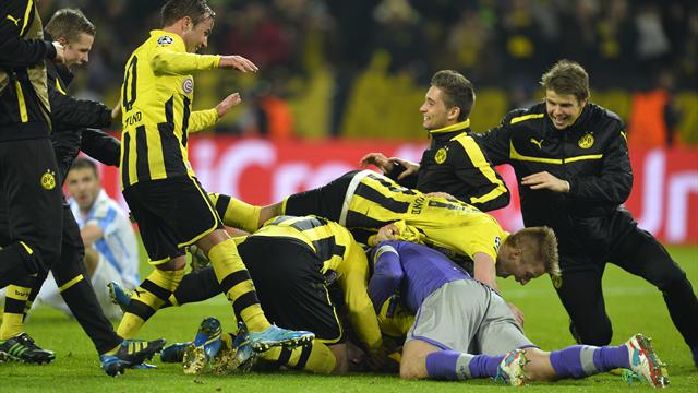 Dortmund score two in injury time to knock out Malaga