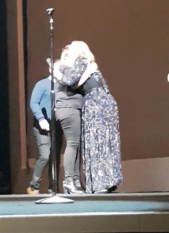 Adele stops performance to invite couple on stage after seeing him proposing in the audience