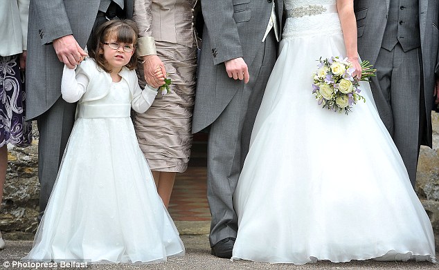 Flower girl takes her first steps thanks to dad