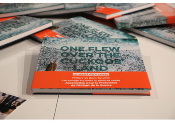 Elio Sassine signs his book “One Flew Over the Cuckoo’s Land”