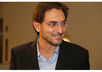 Elio Sassine signs his book “One Flew Over the Cuckoo’s Land”