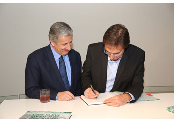 Elio Sassine signs his book “One Flew Over the Cuckoo’s Land”