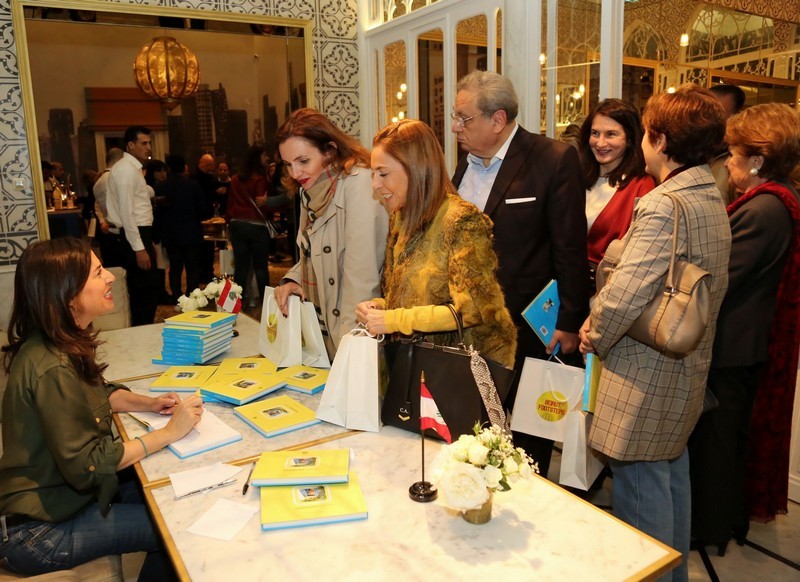 Marie-Noelle Fattal signs her book Beirut Footsteps at Liza restaurant.