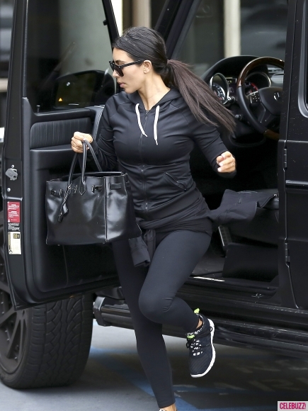 Kim Kardashian goes make-up free as she hits the gym