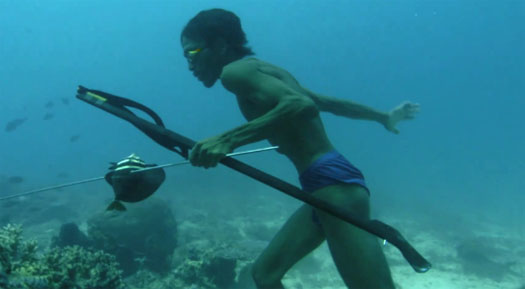 Deep sea hunter fishes underwater on one breath