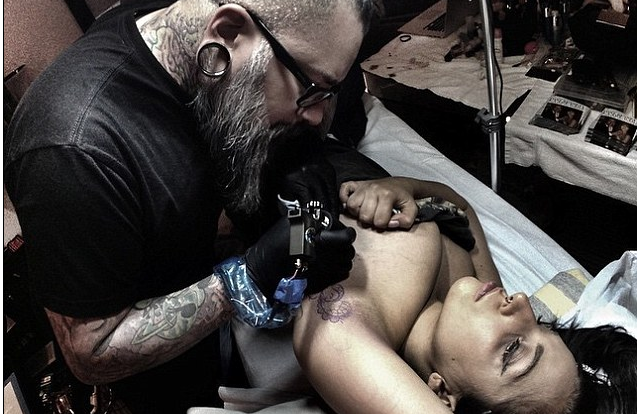 Lady Gaga shares pictures of herself getting new tattoo sprawling from underarm