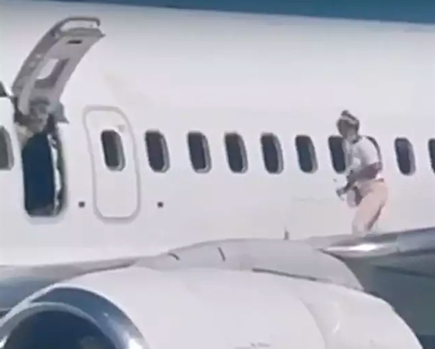 Woman Walks Out On Aeroplane Wing After Complaining She Was 'Too Hot'