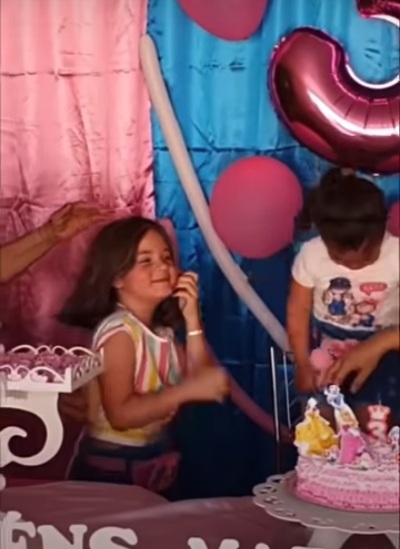 Trending Video: Little girl fights sister for blowing her birthday candle so she slaps her and pulls her hair