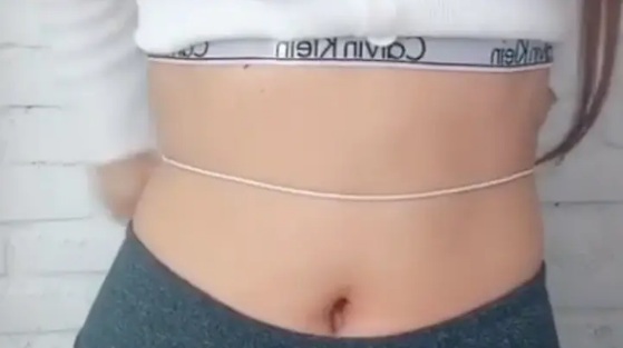 In Video: Influencer Slams Challenge Where People Tie Headphones Around Waist
