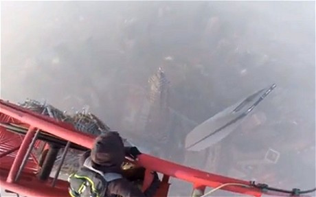 Daredevils scale 128 floor Shanghai Tower without ropes