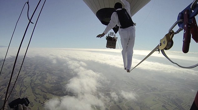 Daredevil tightrope walkers fall after attempting to tread between two hot air balloons 