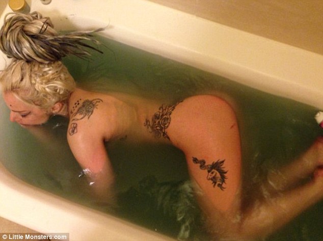 Lady Gaga shares photo of naked self in murky bathtub