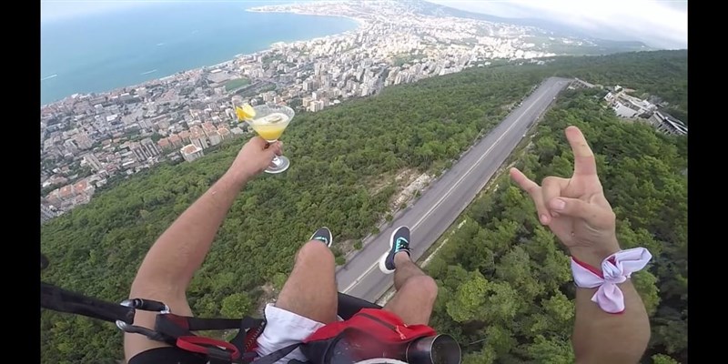 In Video: Lebanese bartender mixing cocktail while paragliding in the sky above Jounieh
