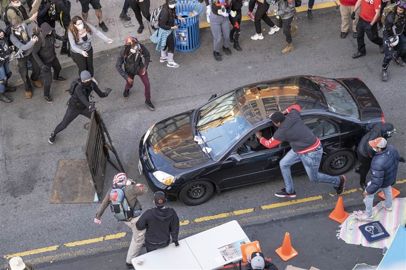 In Video: Man Saves Huge Crowd By Jumping Through Car Window To Stop Dangerous Driver