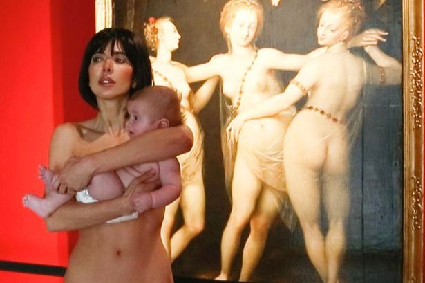  Woman walks around a German museum completely naked while holding a baby  