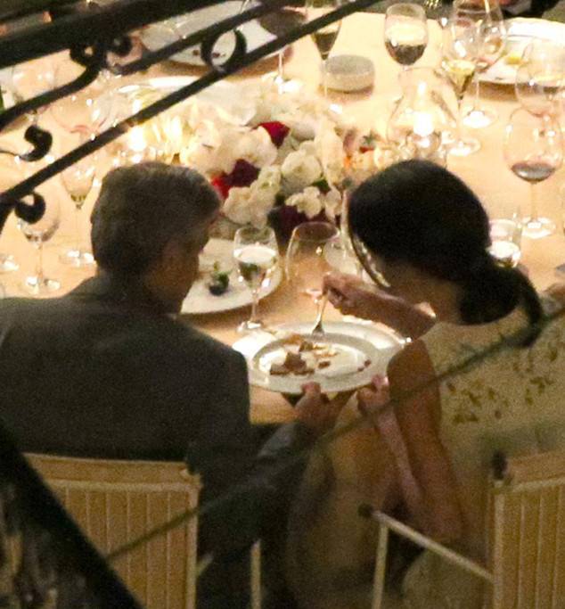 George Clooney and Amal Alamuddin Kiss During Romantic Dinner in Italy