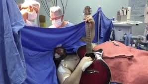 Man plays guitar while undergoing brain surgery