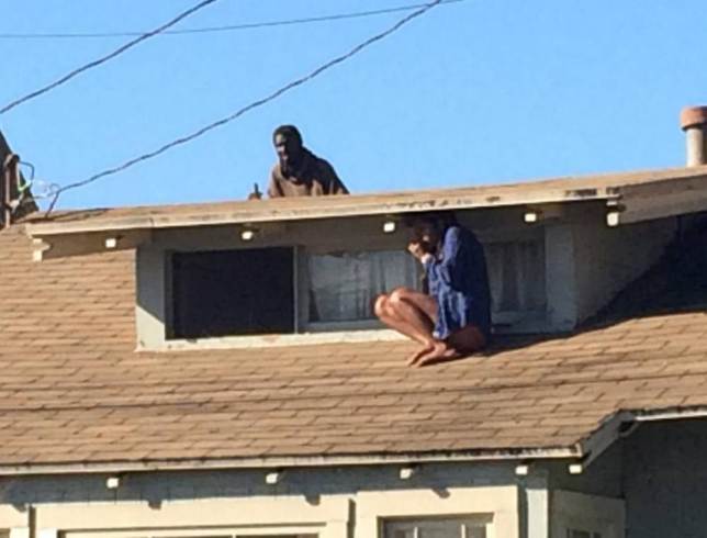 Woman Hides On Her Roof From Intruder