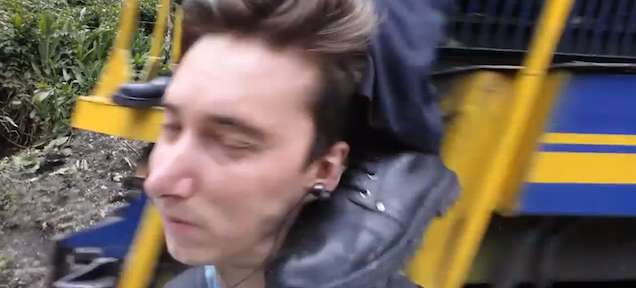 Guy trying to take a selfie gets kicked in the face by train conductor