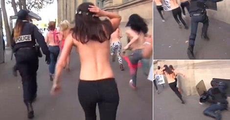 Policeman Runs Into Wall After Getting Distracted By Topless Women Activist