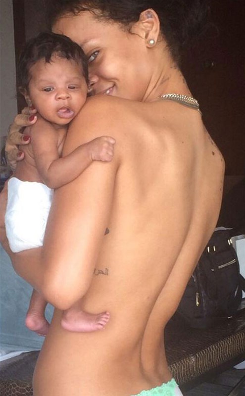 Topless Rihanna Cuddles Her baby Niece