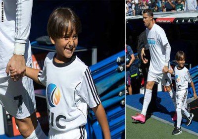 Cristiano Ronaldo hand in hand with little syrian refugee
