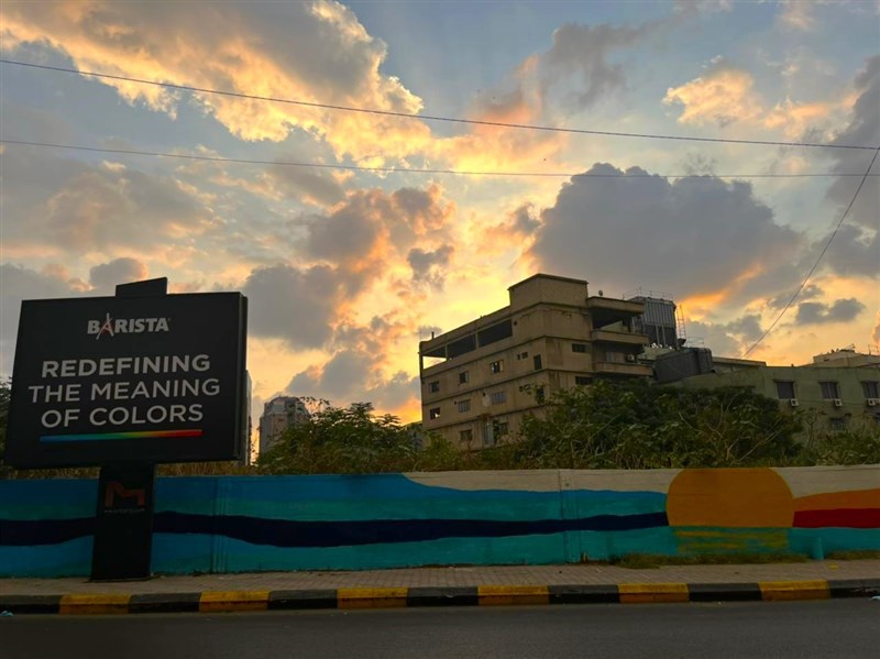 Barista Espresso has turned the wall of Dekwaneh main road into a vivid colorful sunset canvas