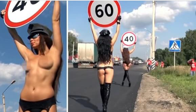 Topless Women Carry Speed Limit Signs For Road Safety Campaign in Russia 
