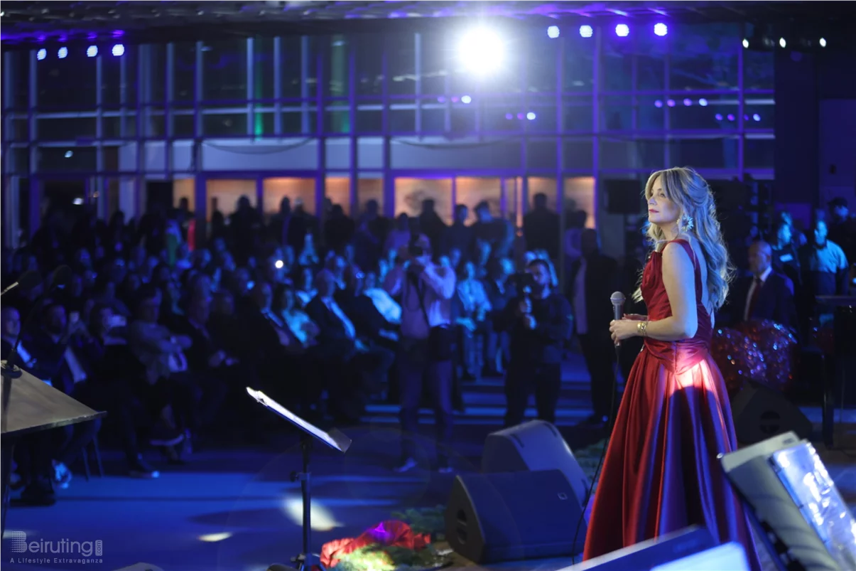 Tania Kassis illuminates Tripoli in a huge Christmas concert with a sublime red dress designed by Robert Abi Nader