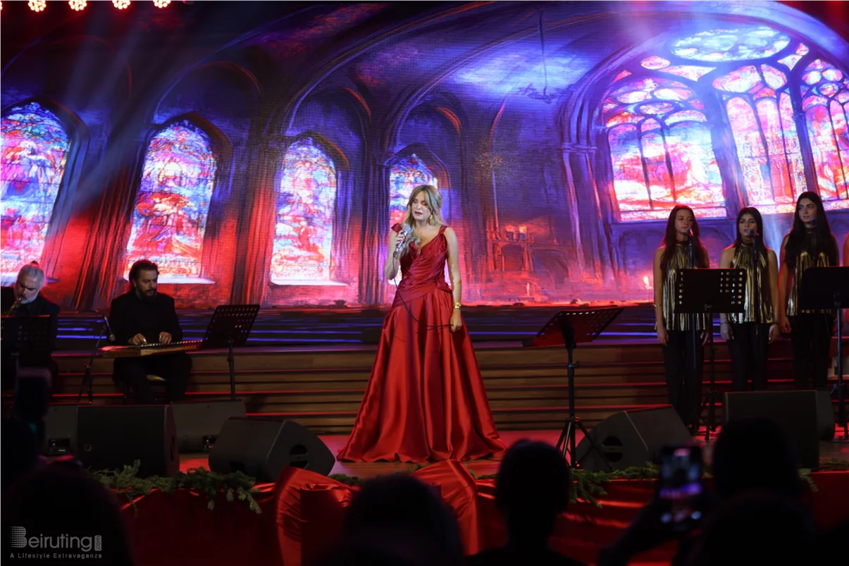 Tania Kassis illuminates Tripoli in a huge Christmas concert with a sublime red dress designed by Robert Abi Nader
