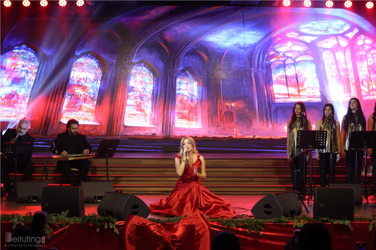 Tania Kassis illuminates Tripoli in a huge Christmas concert with a sublime red dress designed by Robert Abi Nader