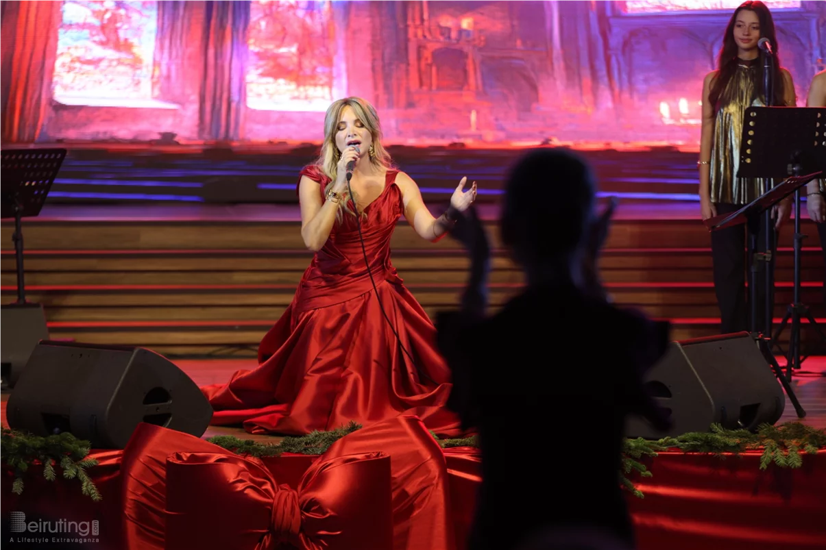 Tania Kassis illuminates Tripoli in a huge Christmas concert with a sublime red dress designed by Robert Abi Nader